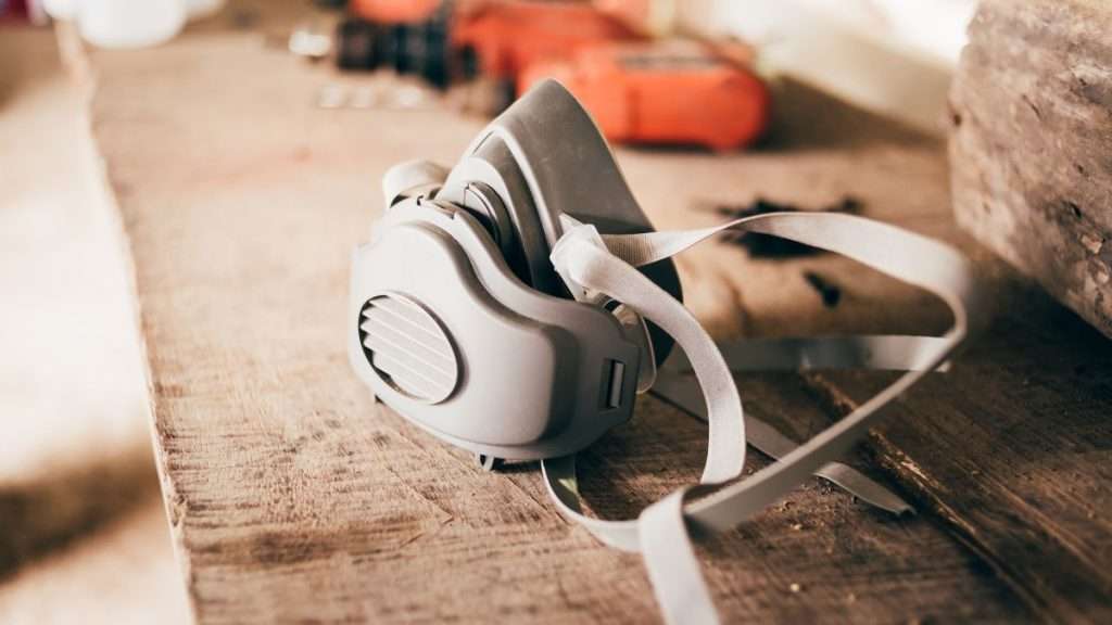 The PPE for Woodworking I Use Daily (And Recommend) - Feat. Im. - Dust mask on a wooden workbench