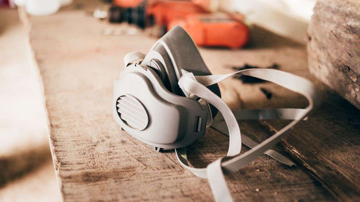 The PPE for Woodworking I Use Daily (And Recommend) - Feat. Im. - Dust mask on a wooden workbench