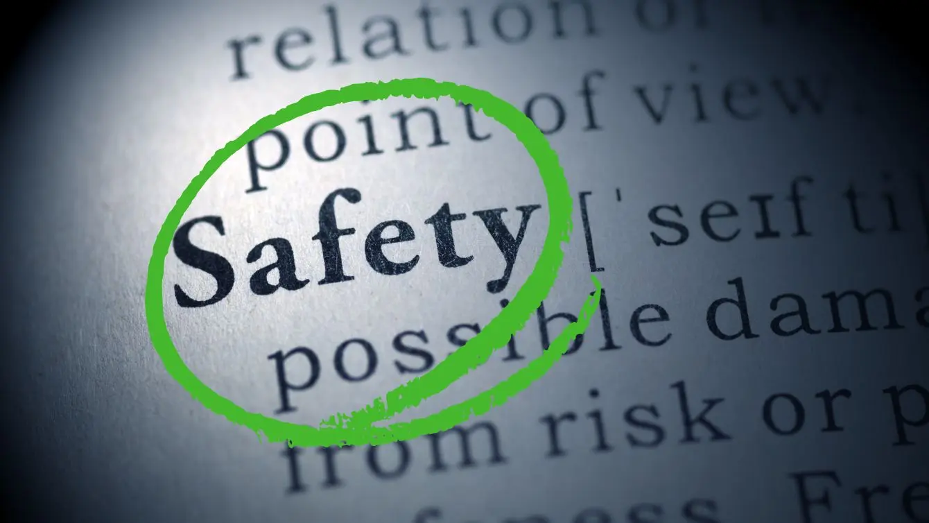 Clean safe workshop hero image with the word “Safety” highlighted in green on a printed page.