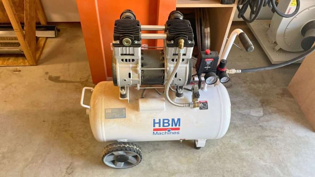 Low noise compressor reducing sound stress in a safe woodworking environment.
