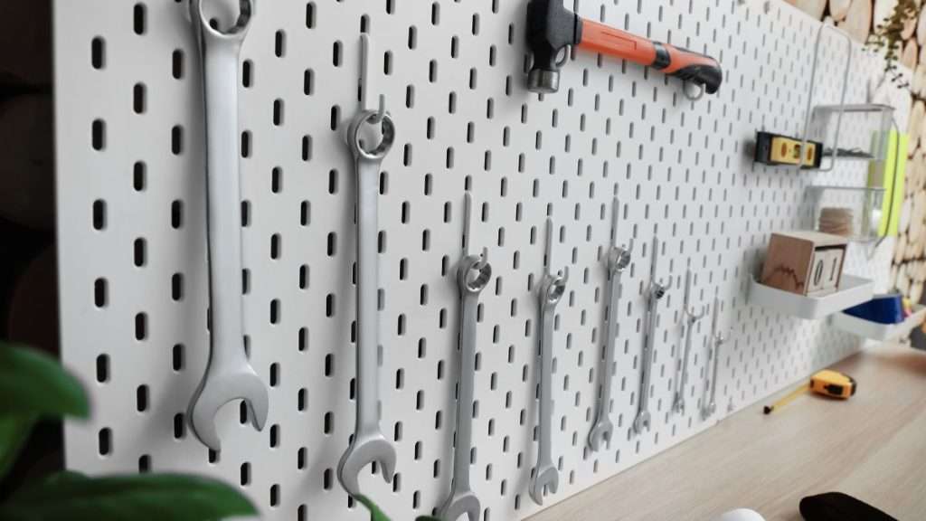 Pegboard wall with organized hand tools for efficient workshop storage