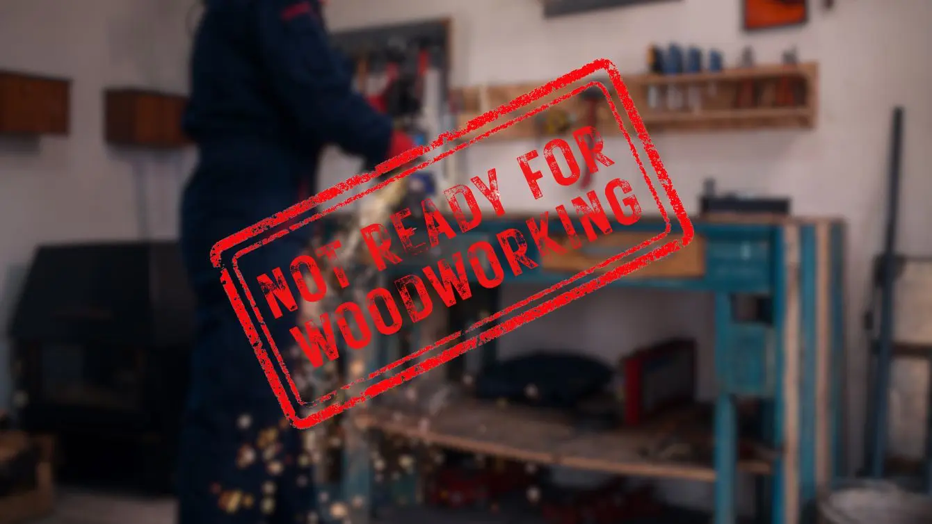 Blurred workshop scene with a red not ready for woodworking stamp, highlighting the core idea of recognizing early warning signs.