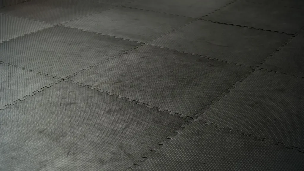 Close up of interlocking workshop tiles used as flooring for small workshops.