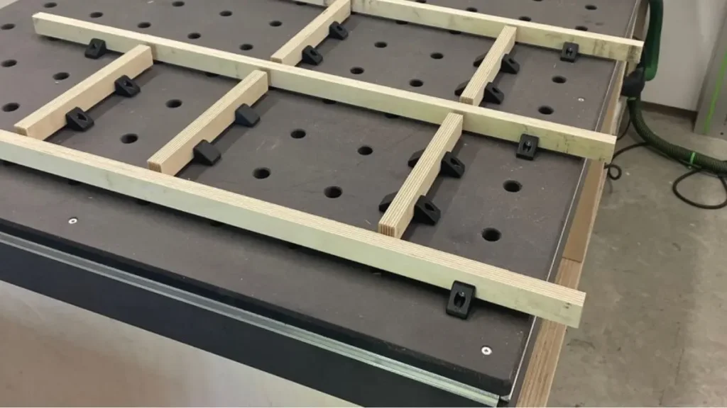 3D printed blocks used as adjustable DIY woodworking jigs on an MFT-style workbench.