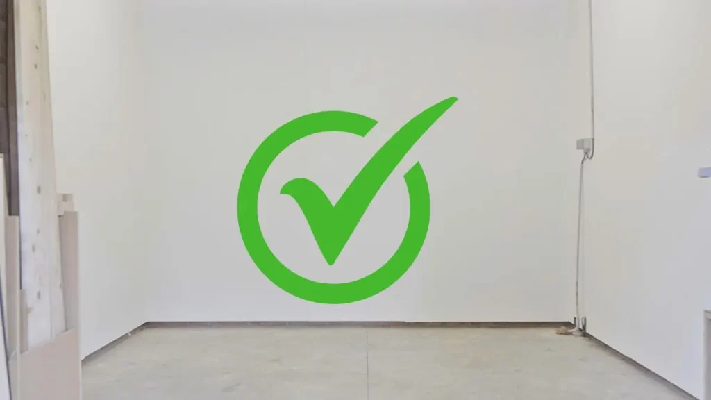 Empty room marked with a green check as a good Woodworking Shop Space option.