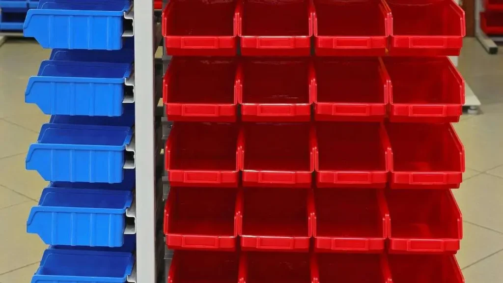 Wall-mounted storage bins and organization system used to set up a woodworking shop efficiently.
