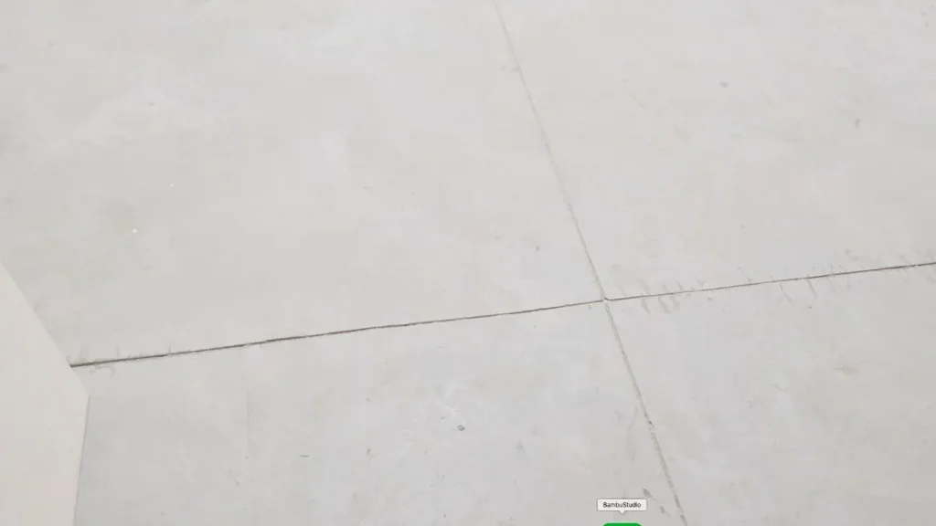 Bare concrete workshop floor used while preparing a woodworking shop.