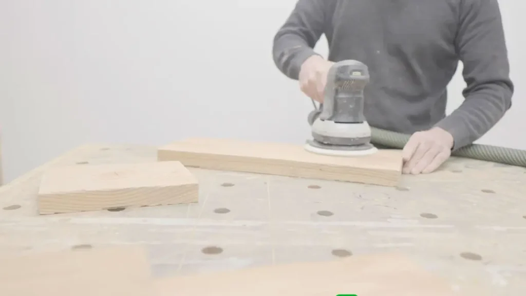 Sanding a board smooth using woodworking techniques for better shaping and surface prep