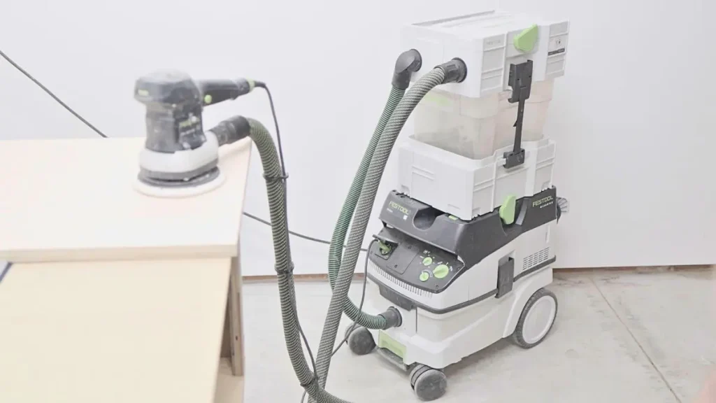 Dust extractor and sander setup showing safe Woodworking Tools for beginners.