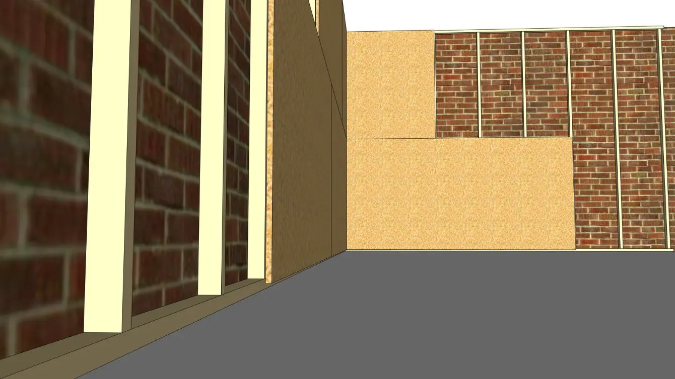 Close view of OSB panels being installed on a small workshop wall, showing how OSB for shop walls looks during mounting.