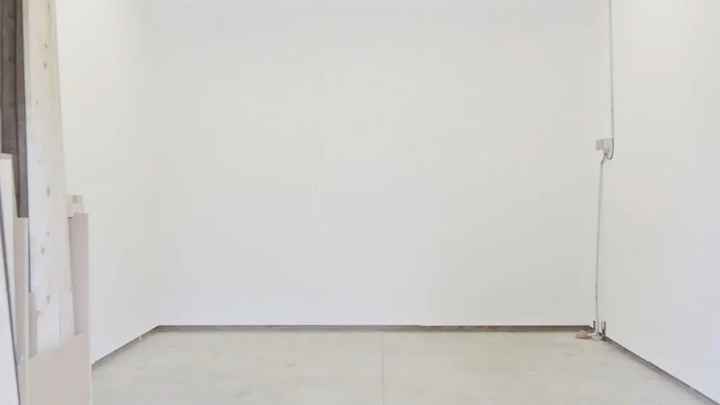 Painted MDF workshop walls that look brighter and feel larger after using the best paint for workshop walls.